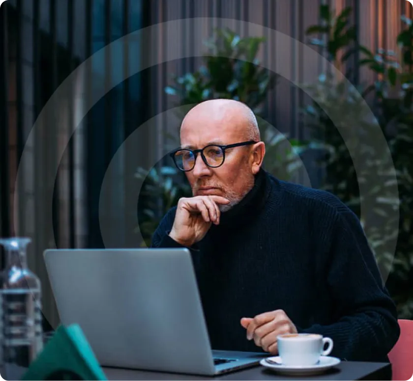 Security professional working at laptop